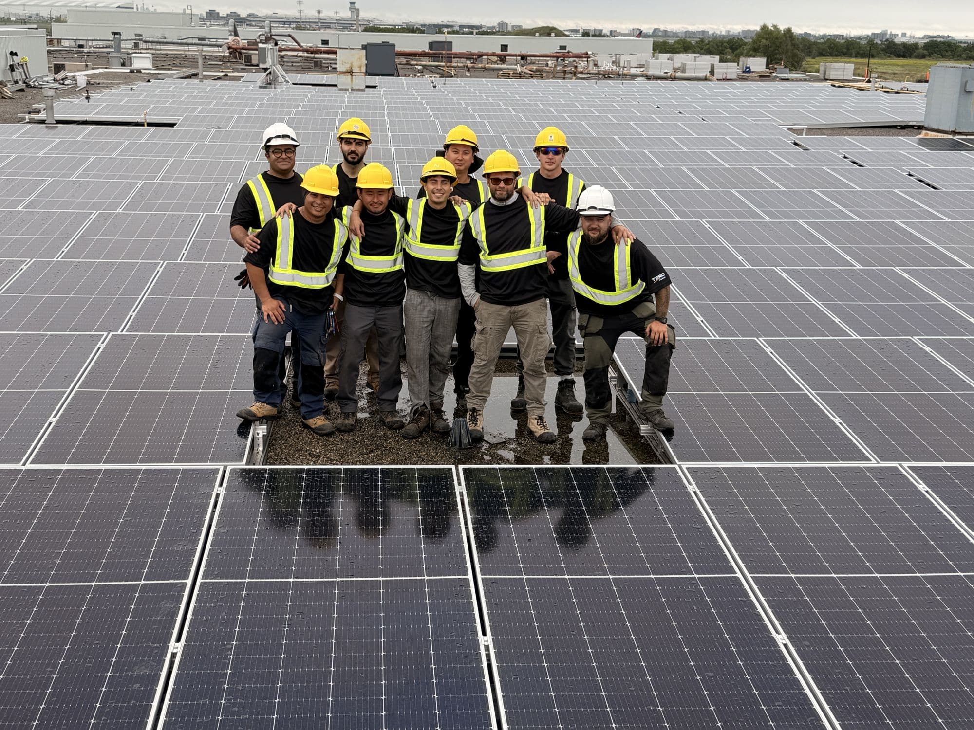 The Tero Power crew on a completed rooftop solar array